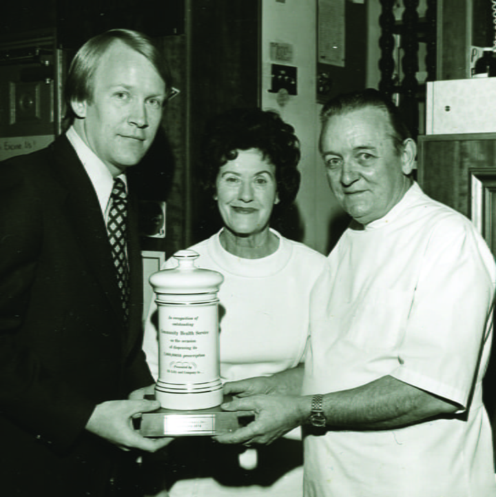 Ed Besse receiving an award in 1974