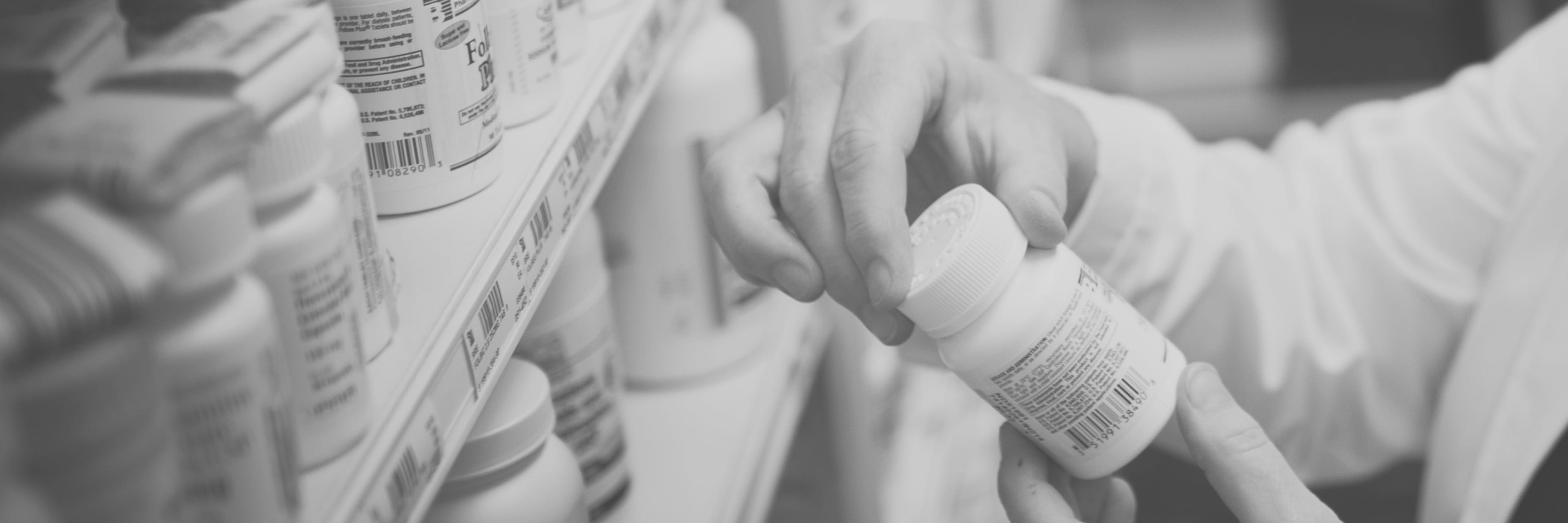 Pharmacist holding a bottle